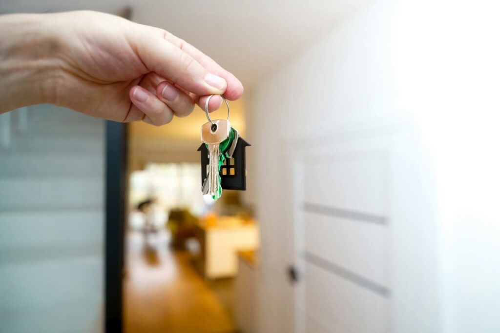 Tenant holding house keys in a doorway